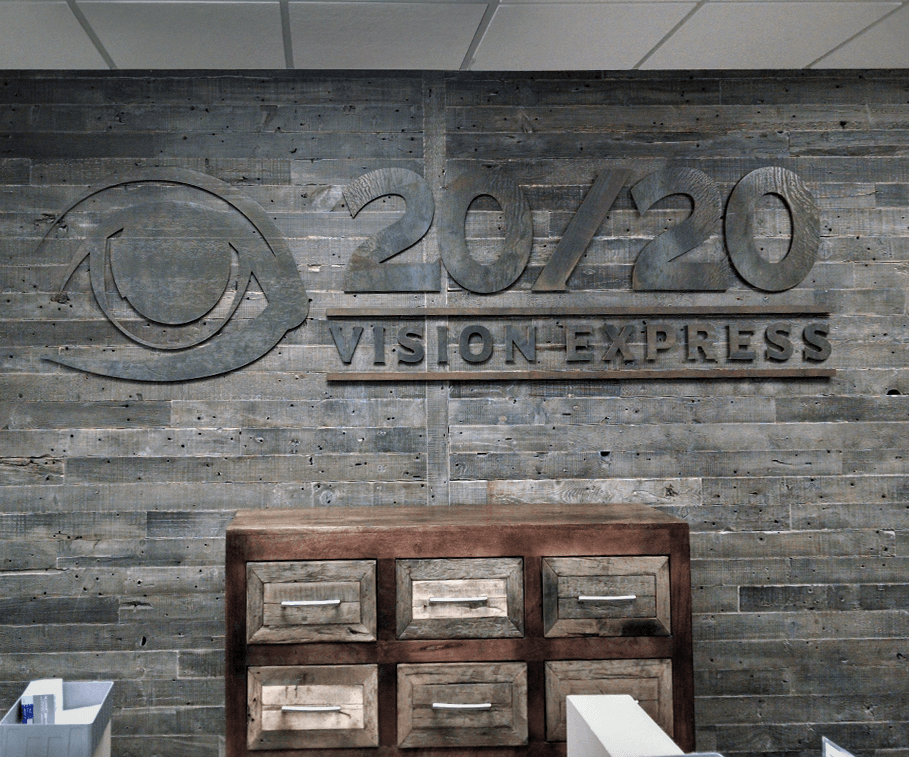 Interior Logo on reclaimed wood wall for 2020 Vision Express Rustic rust looking letters