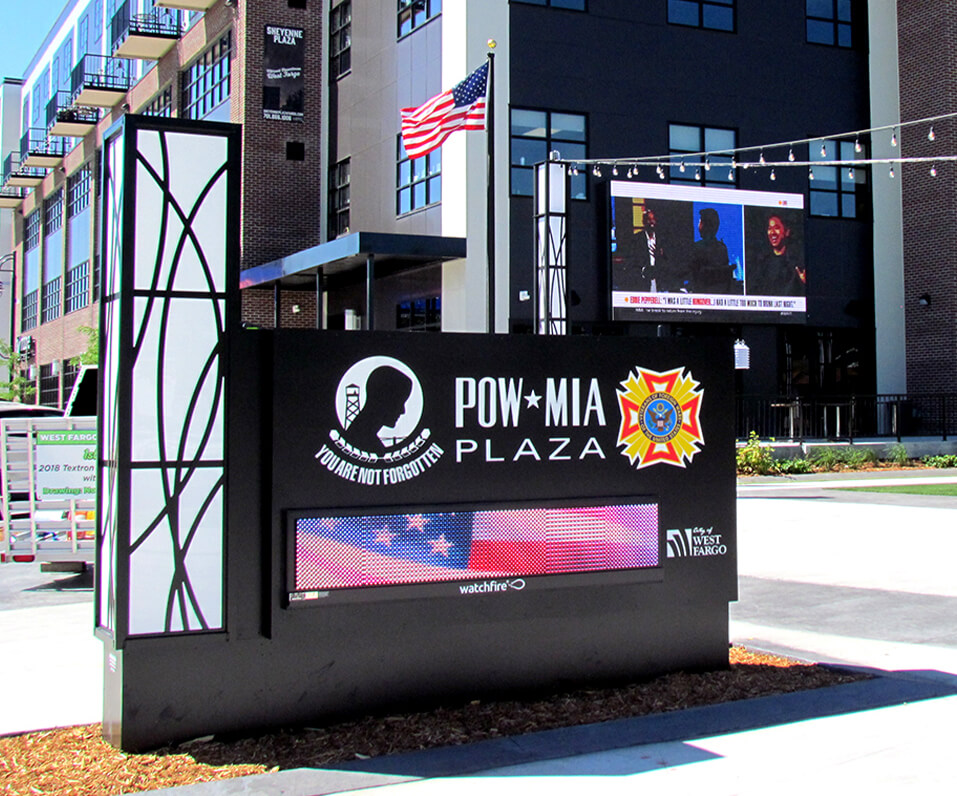 Pow Mia Plaza West Fargo ND monument sign with full color digital display and custom lighting accent