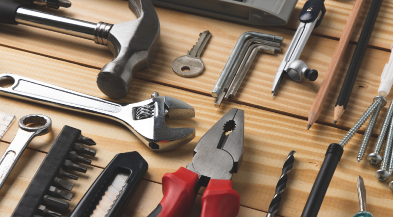 a variety of hand tools on a table